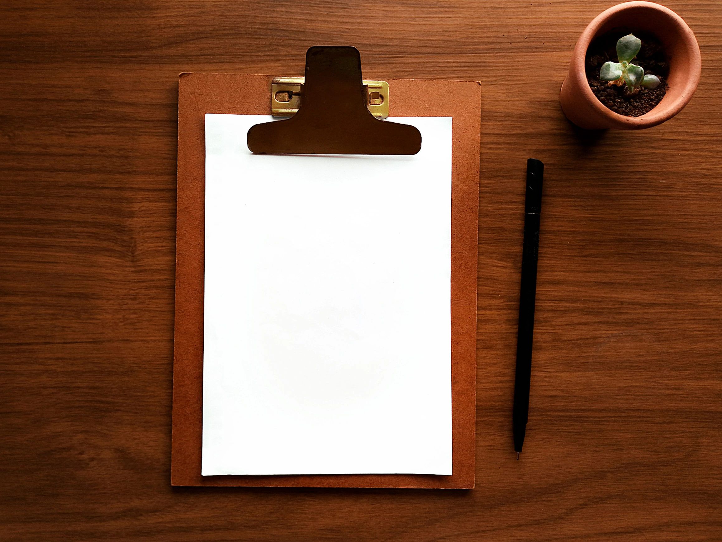 Clipboard and documents on editorial desk