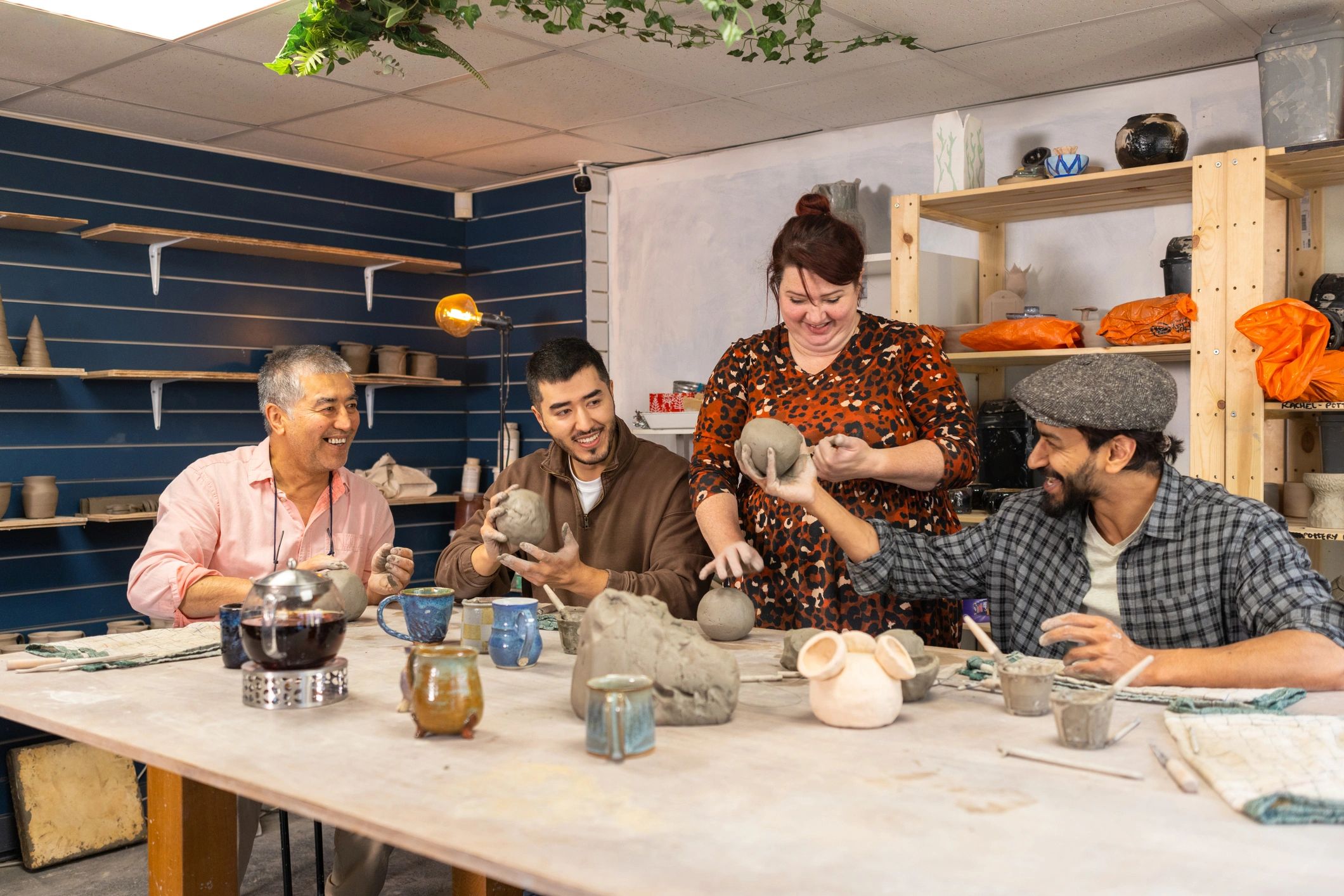 Artisan workshop with makers learning pottery