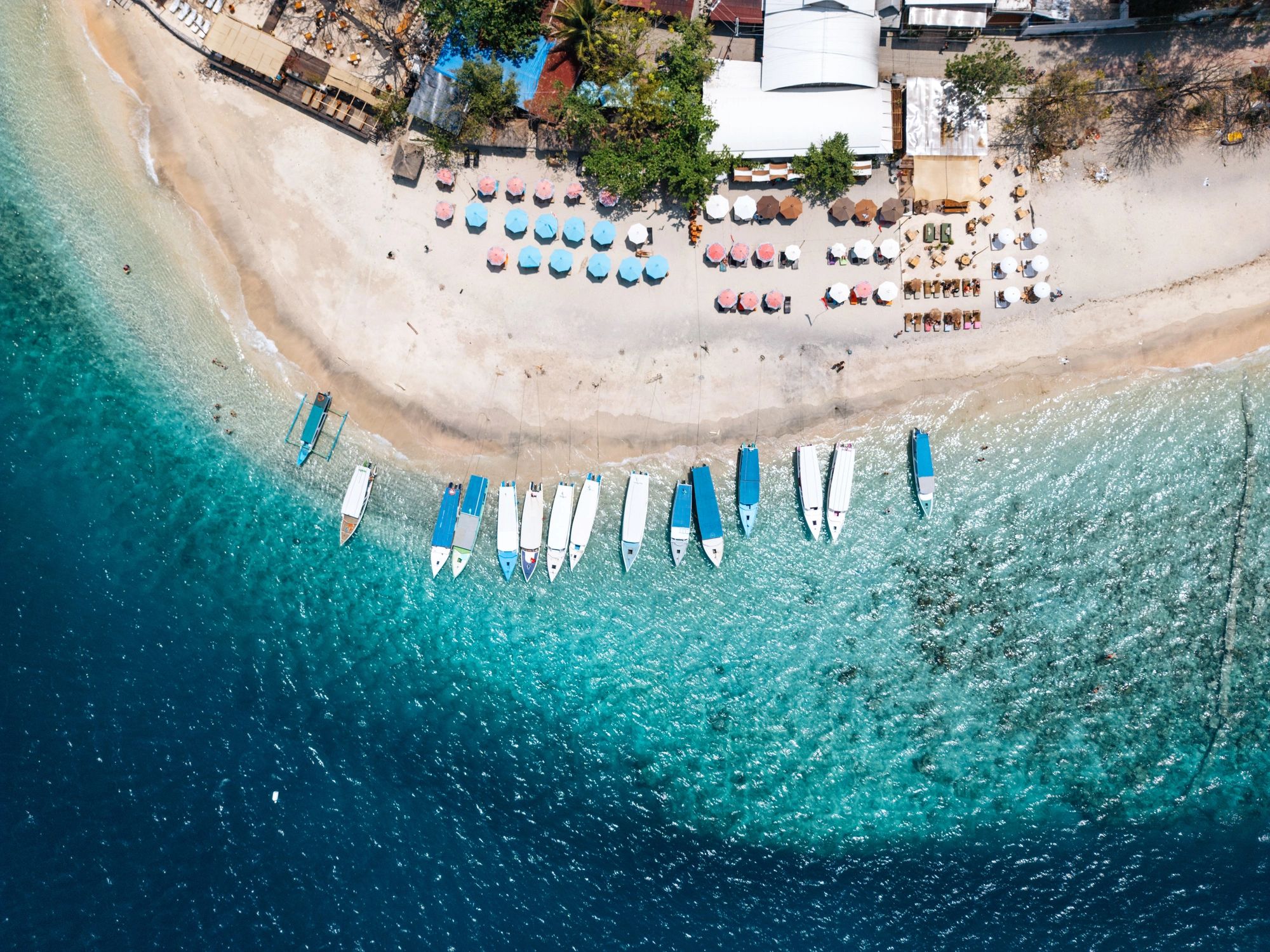 Tropical beach with boats in Lombok, Indonesia